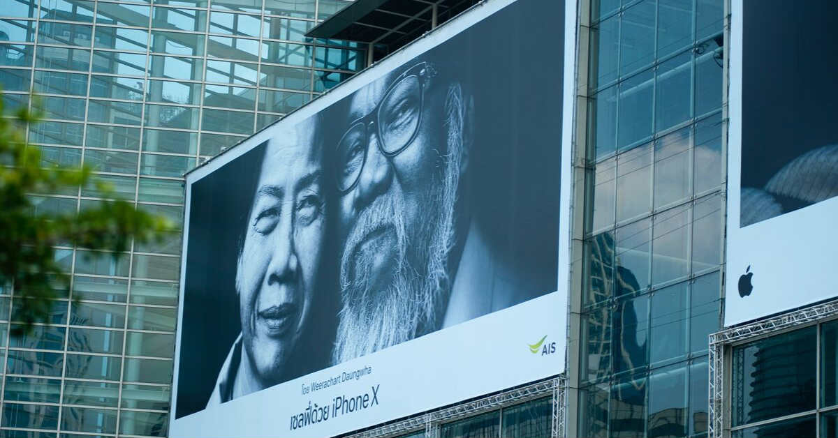 old man and woman on billboard