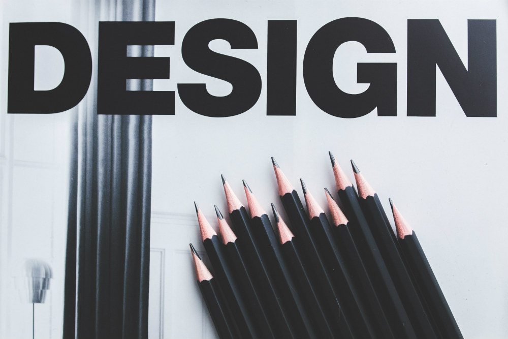 design text and pencils